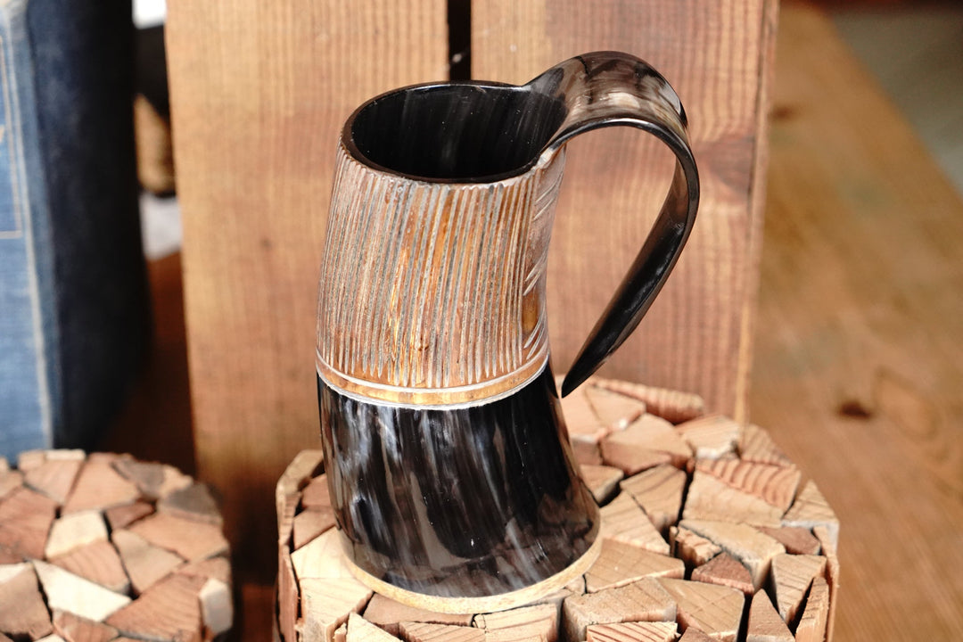 Two-tone horn stein, upright view with dark rim and carved vertical texture