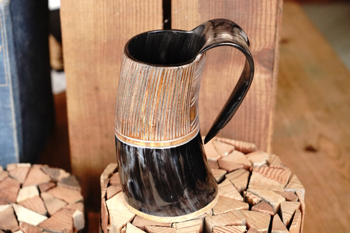 Two-tone horn stein, upright view with dark rim and carved vertical texture