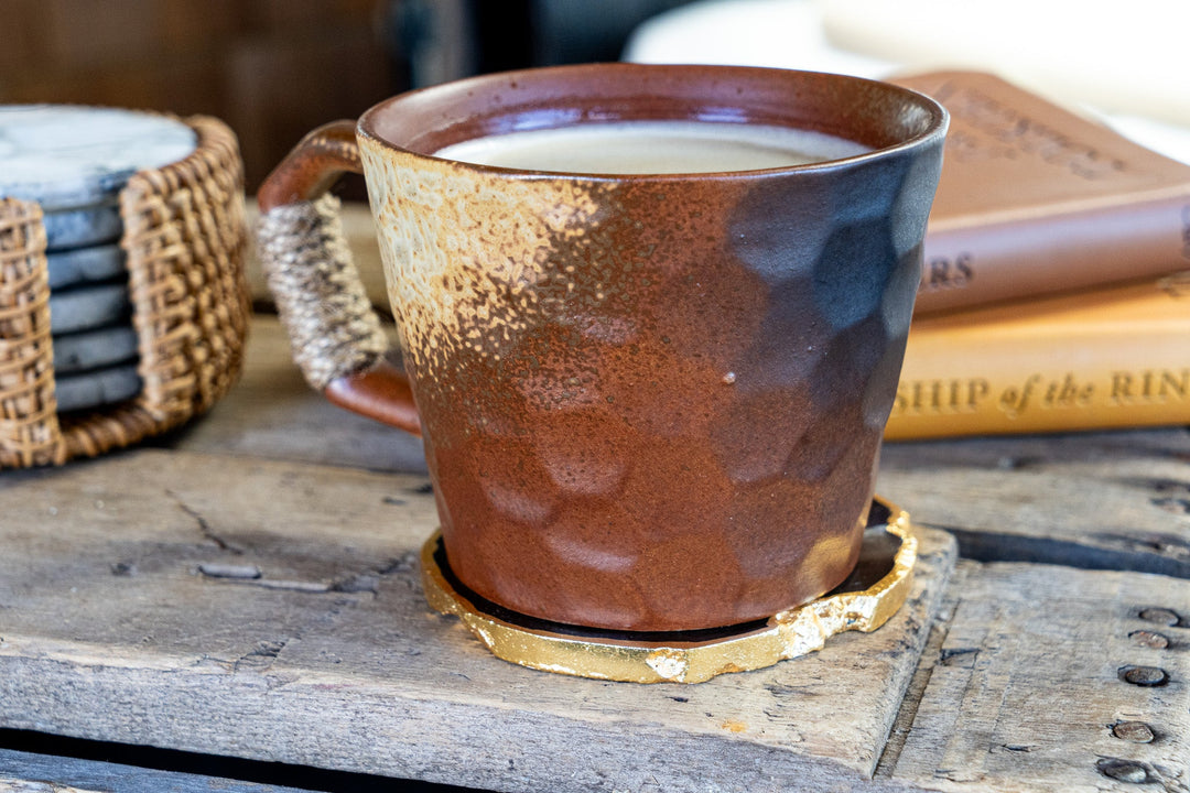 Textured ceramic mug with speckled glaze, thick rim, wrapped handle detail