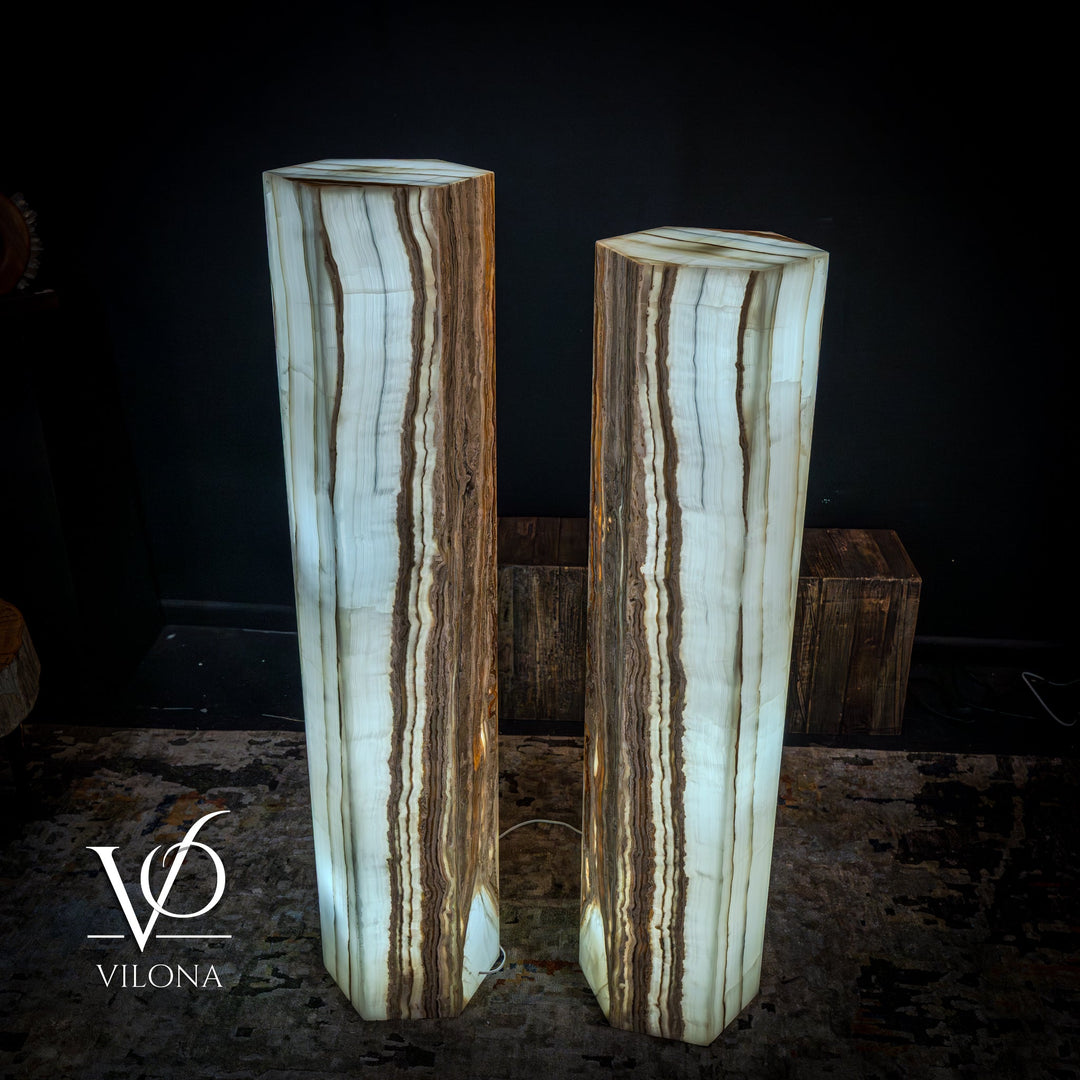 Pair of floor lamps with pale white onyx shades showing thin vertical brown streaks