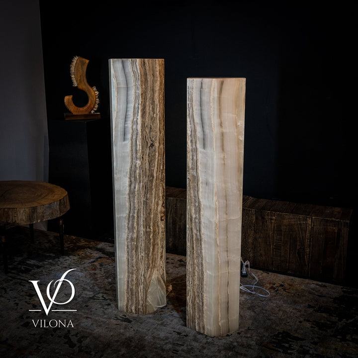 Pair of floor lamps with light beige onyx shades and darker vertical vein lines