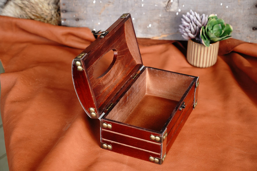 Open cherry wooden tissue box with bronze hardware, empty interior compartment
