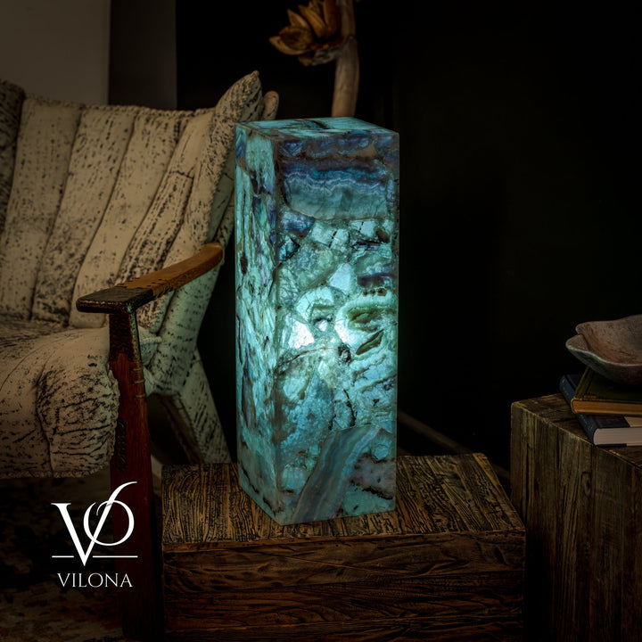 Fluorite crystal table lamp with square teal-blue crystal prism and uneven natural stone texture