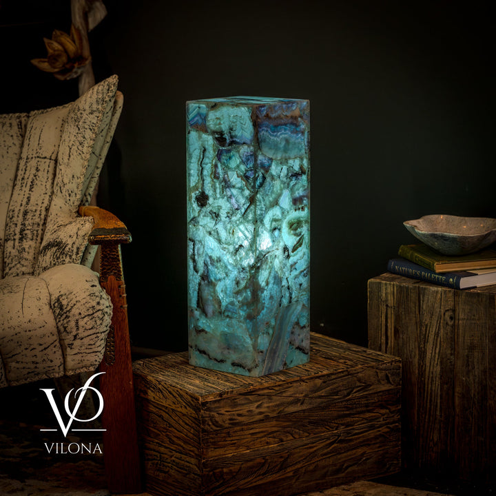 Fluorite crystal table lamp, glowing teal-blue square prism with intricate veining