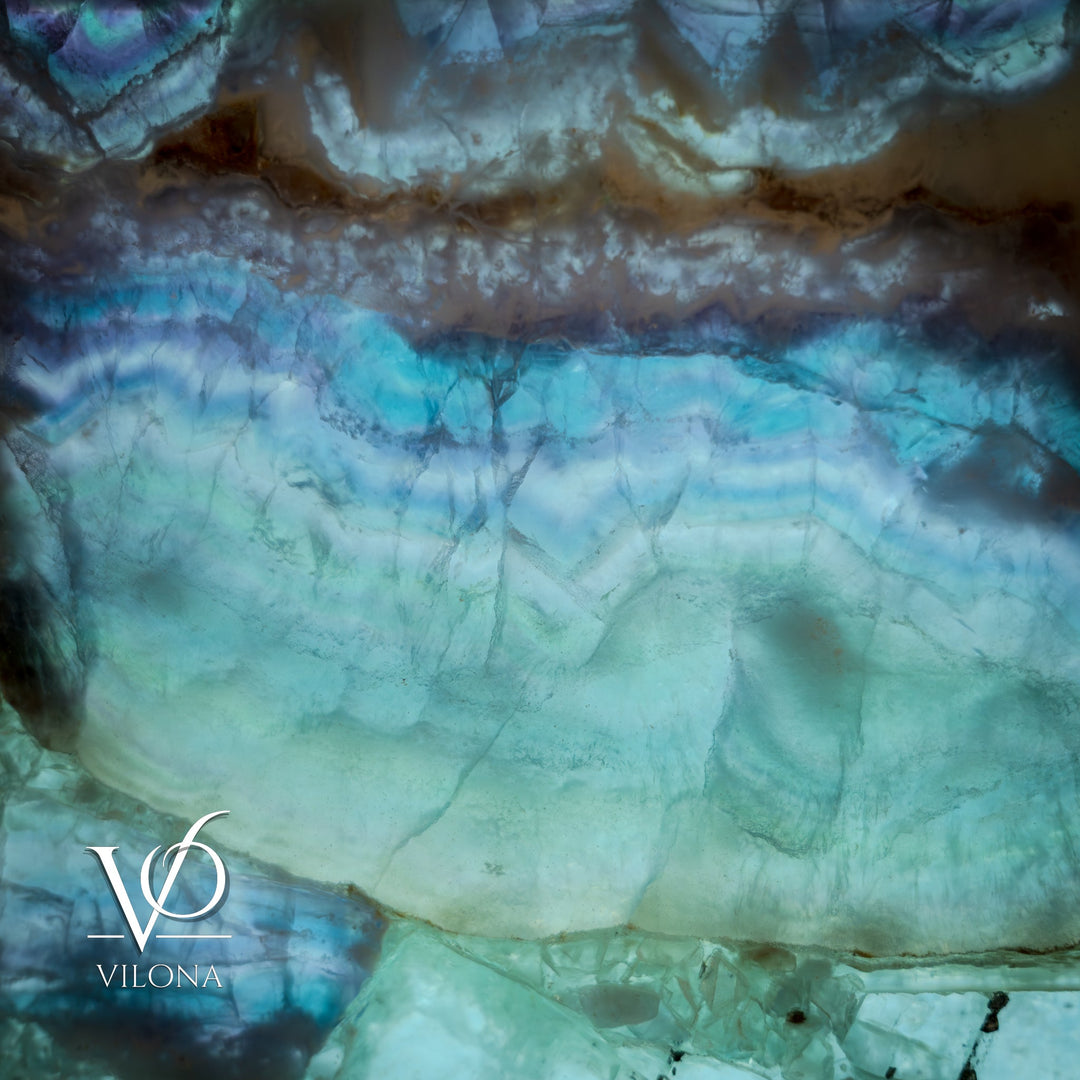 Fluorite crystal table lamp close-up of teal-blue internal glow and layered stone band