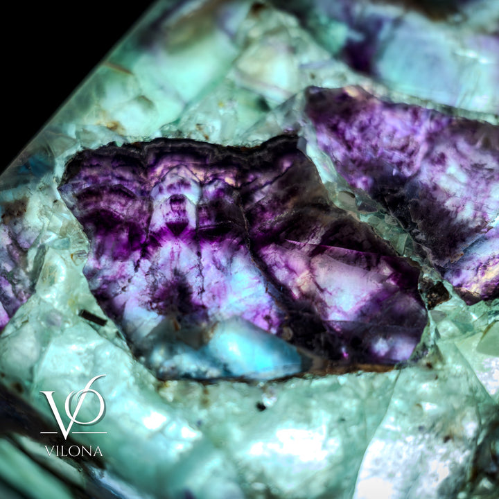 Fluorite crystal table lamp close-up of recessed purple crystal area in teal stone