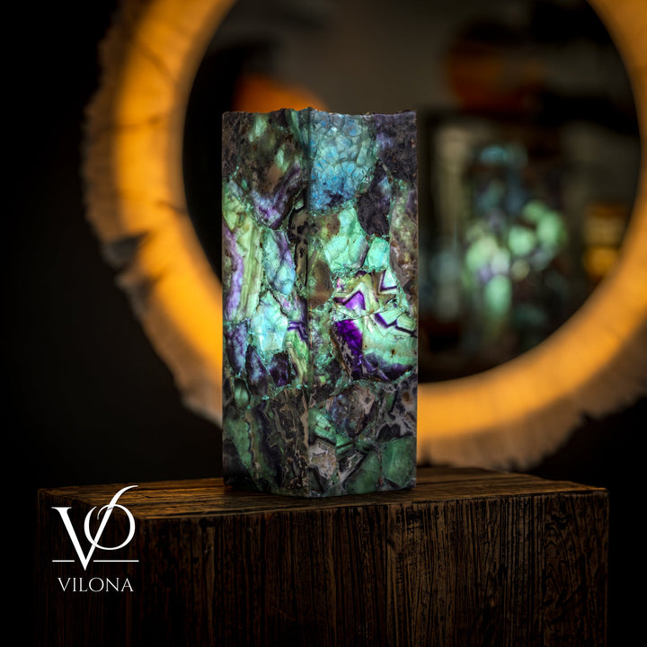 Fluorite table lamp, front view of square fluorite with teal glow and dark veining