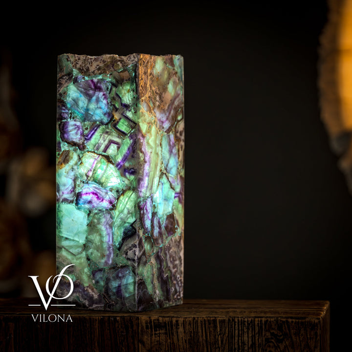 Fluorite table lamp, square live-edge fluorite face with teal-green light and violet cracks