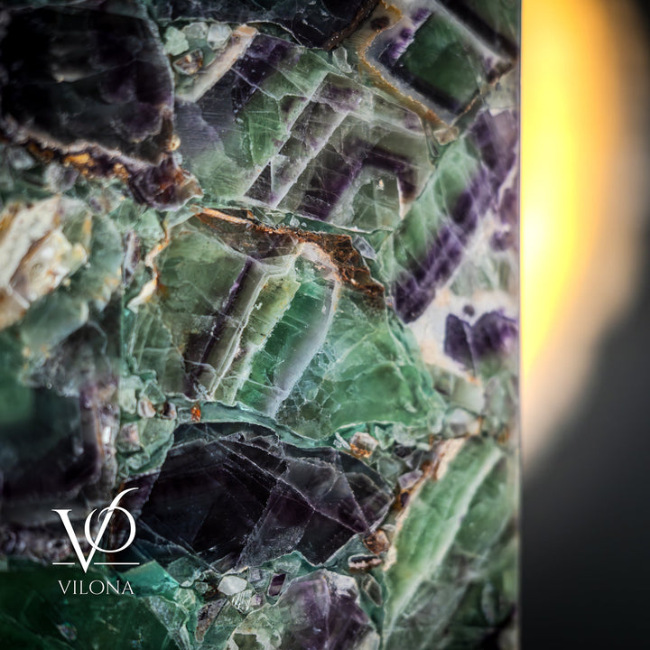 Fluorite table lamp, close-up of glowing fluorite facets in green, blue, and violet