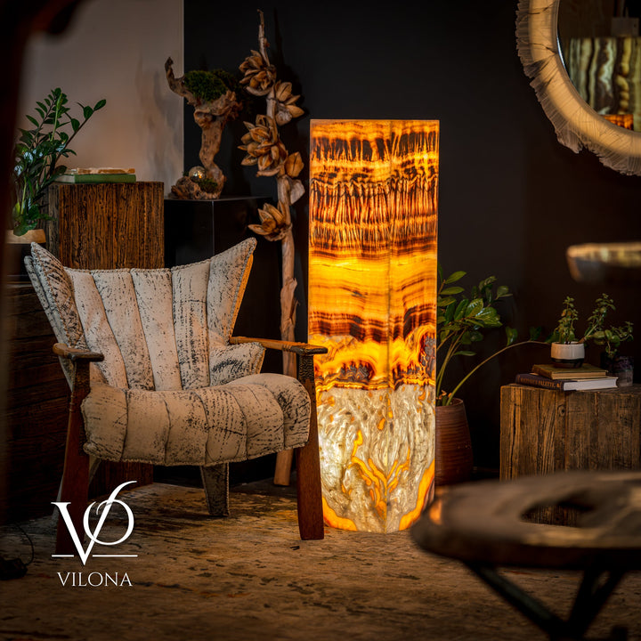 Onyx floor lamp with glowing square shade in golden amber and dark banded design