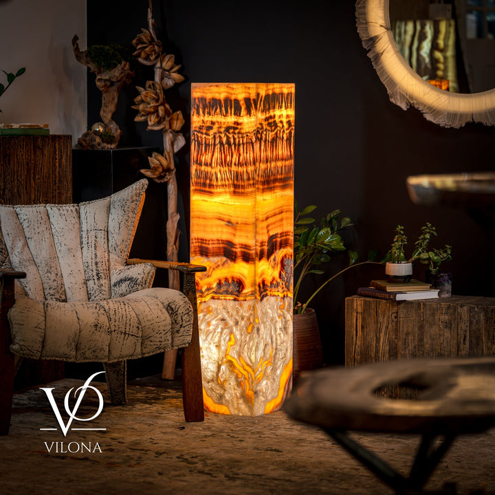 Onyx floor lamp showing glowing square shade with flowing orange streaks and dark accents