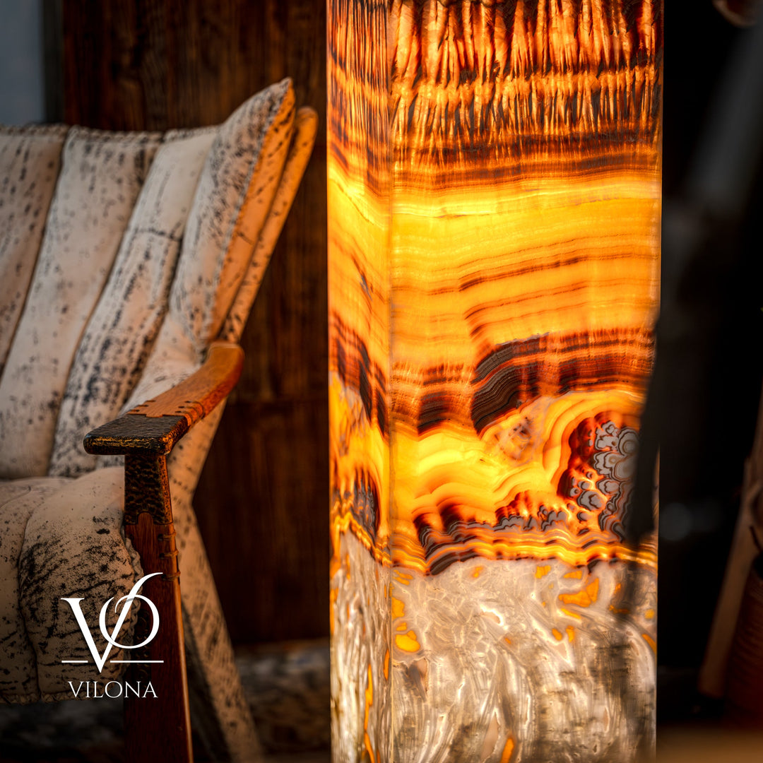 Onyx floor lamp close-up of glowing square shade with amber bands and dark grooves