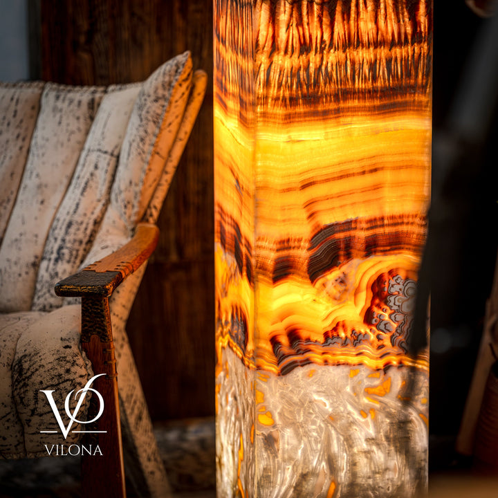 Onyx floor lamp close-up of glowing square shade with amber bands and dark grooves