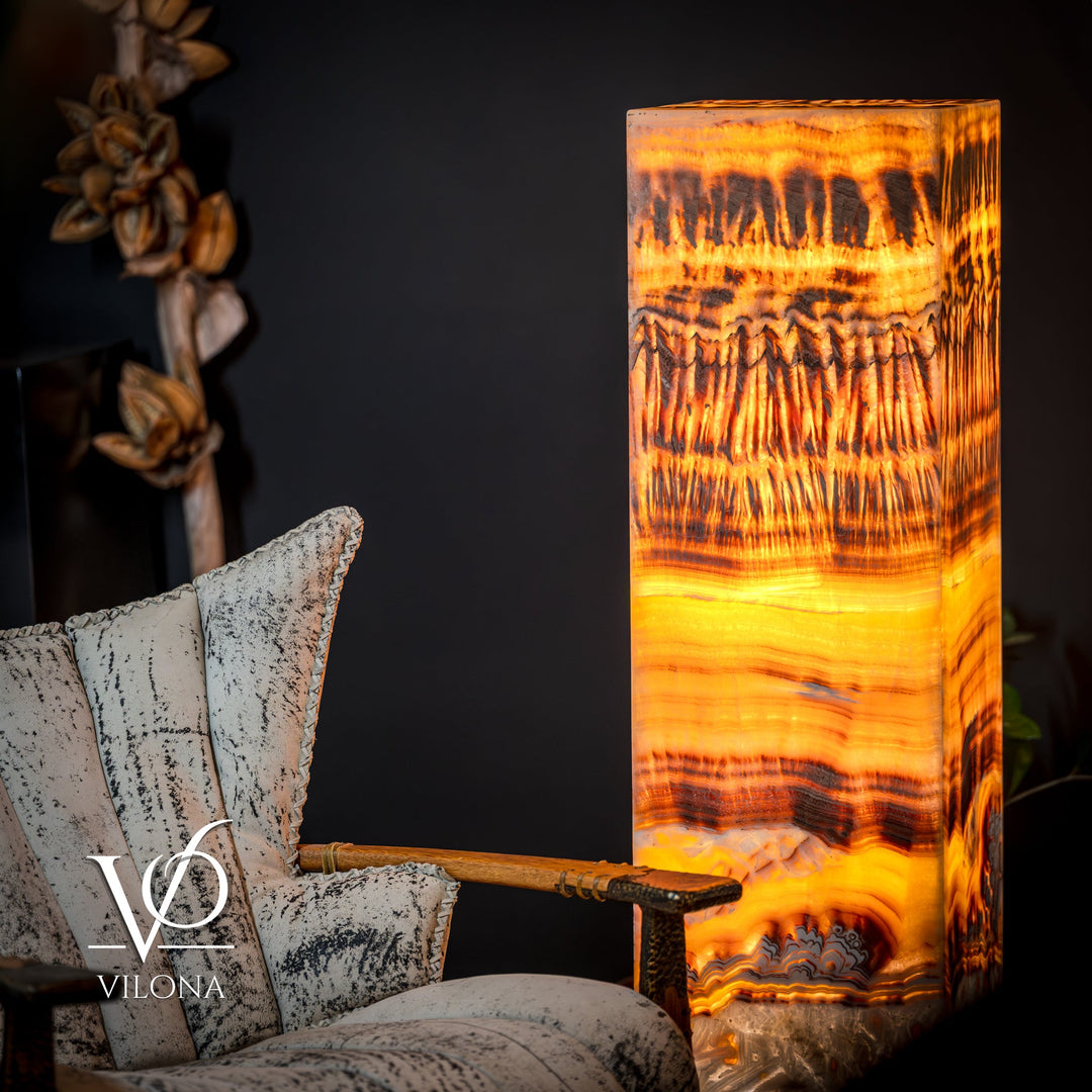Onyx floor lamp with golden orange glowing square shade and vertical drips pattern