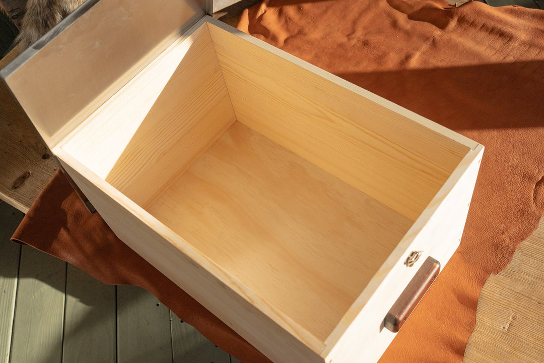 Light wood storage box open, interior view with latch hardware