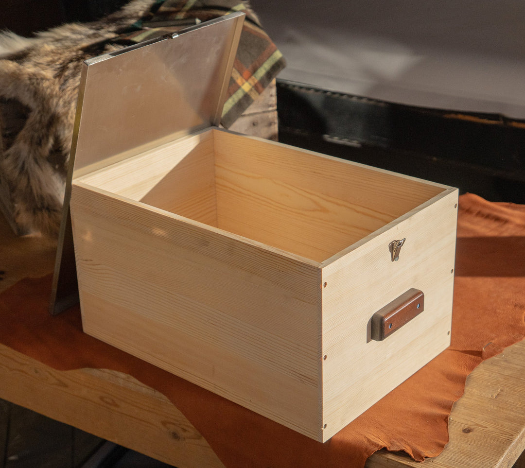 Light wood storage box open, showing interior and stainless lid hardware