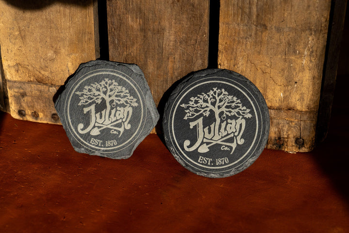 Slate round coaster set with engraved tree crest and 'EST. 1870' medallions