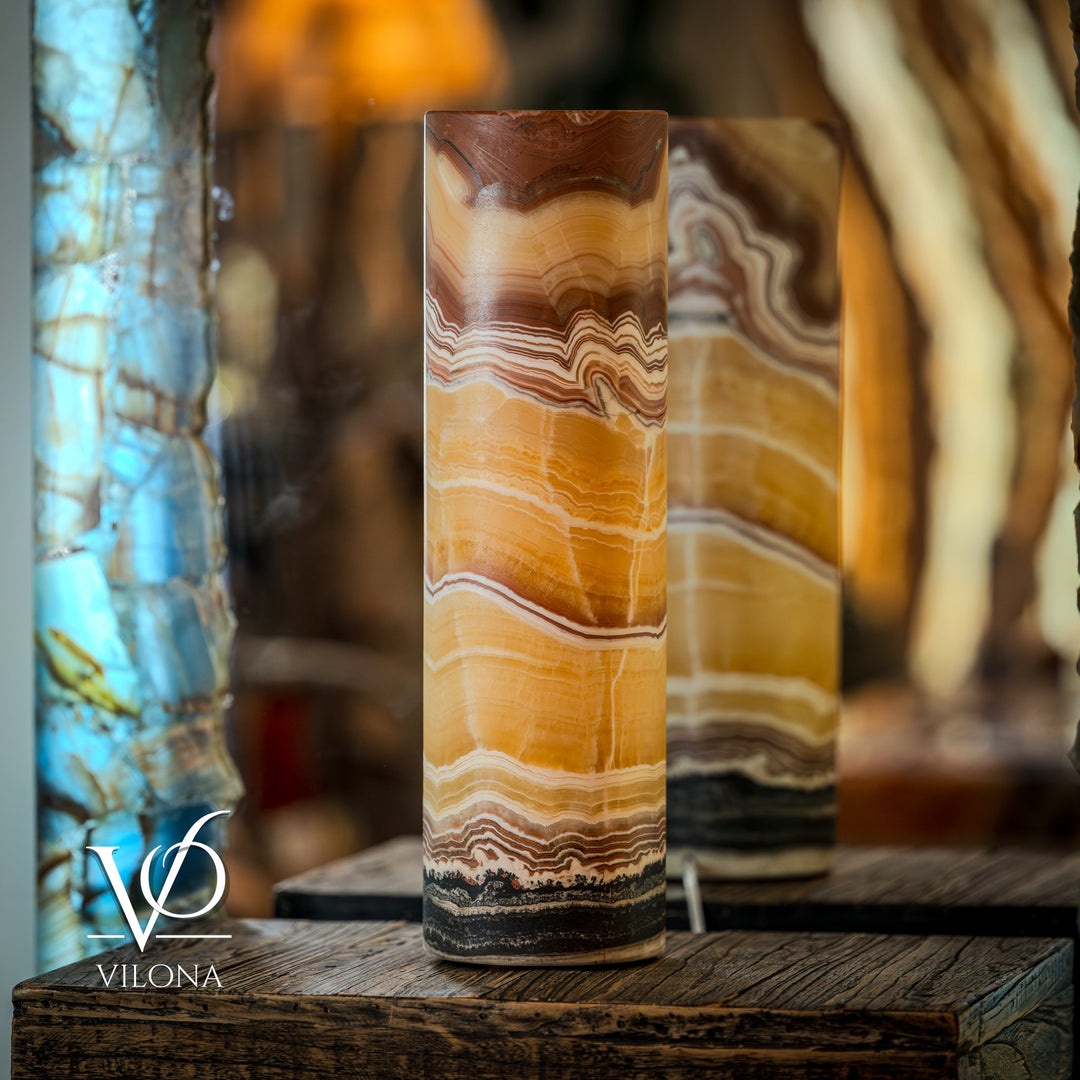Table lamp with tall cylinder shade, sunset onyx pattern in amber, white, and brown