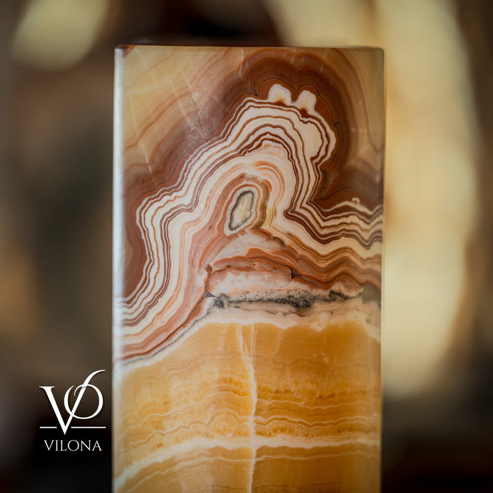 Tall cylinder lamp shade with layered onyx bands in cream, amber, and brown