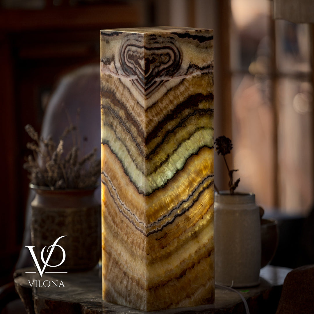Square table lamp with glowing onyx-style shade and swirling veining in stacked bands