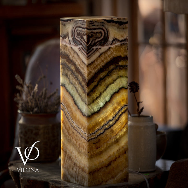 Square table lamp with glowing onyx-style shade and swirling veining in stacked bands
