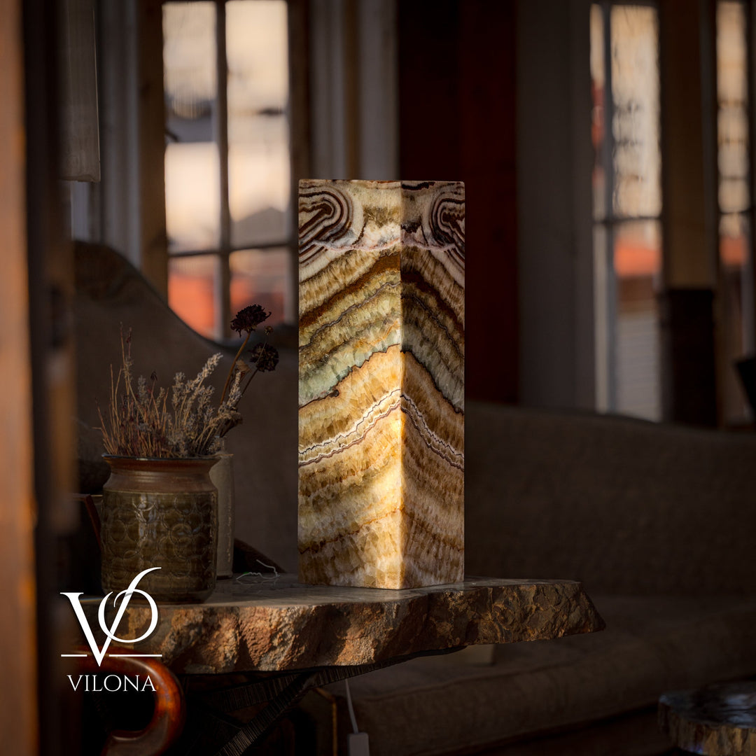 Square table lamp with lit onyx-style square shade and banded stone pattern