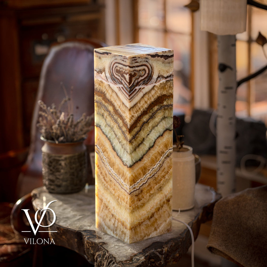 Lit square table lamp with onyx-style rectangular shade featuring swirling stone veins