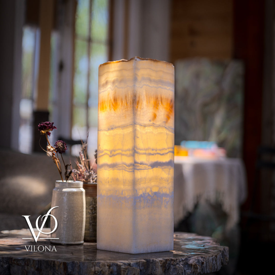 Square onyx-style table lamp with translucent cream shade and warm amber glow