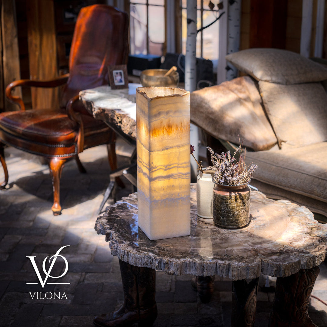 Onyx-style square table lamp with cream-and-amber veined shade glowing warmly