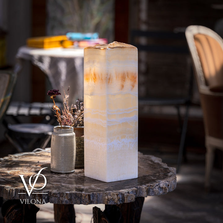 Square cream onyx-style lamp with amber-lit veining and top opening