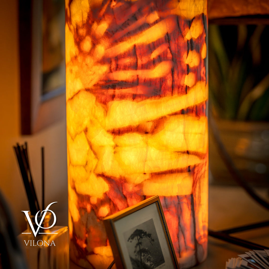 Onyx-style table lamp with amber marble-pattern shade, lit with warm glow