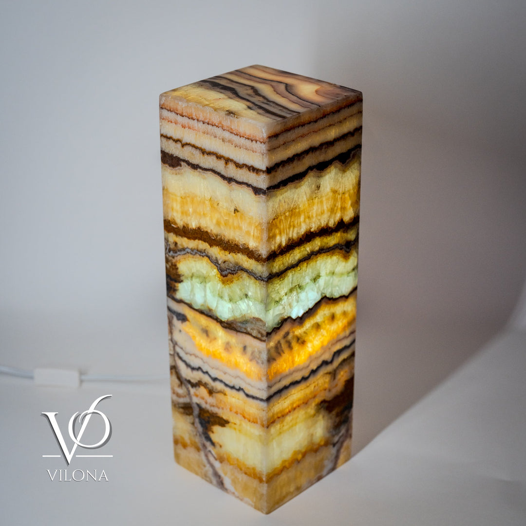 Onyx-style square table lamp showing multicolor striated stone column and flat top