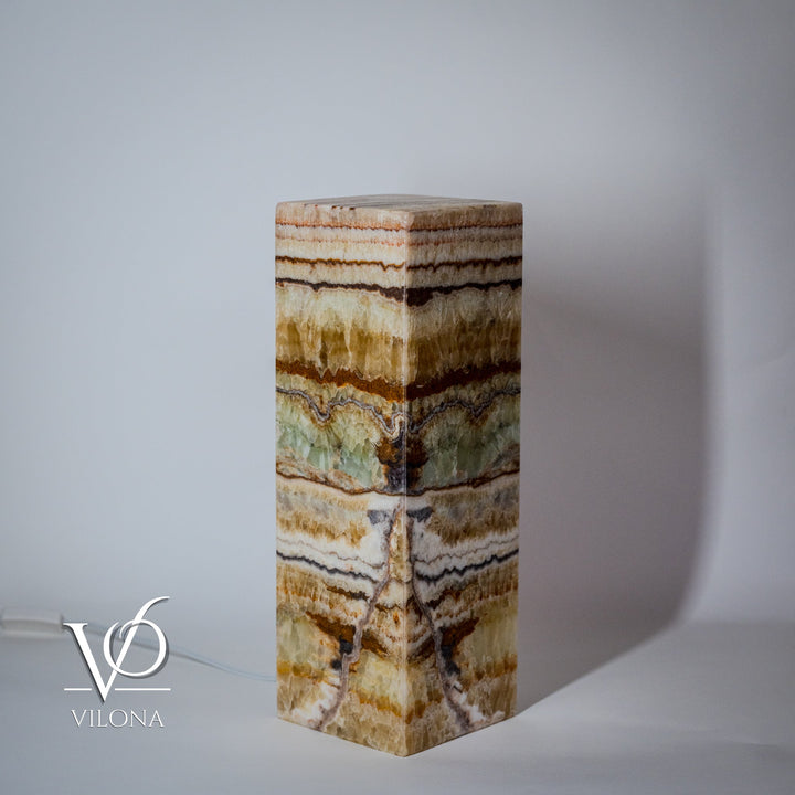 Onyx-style square table lamp with multicolor banded stone column base and flat top