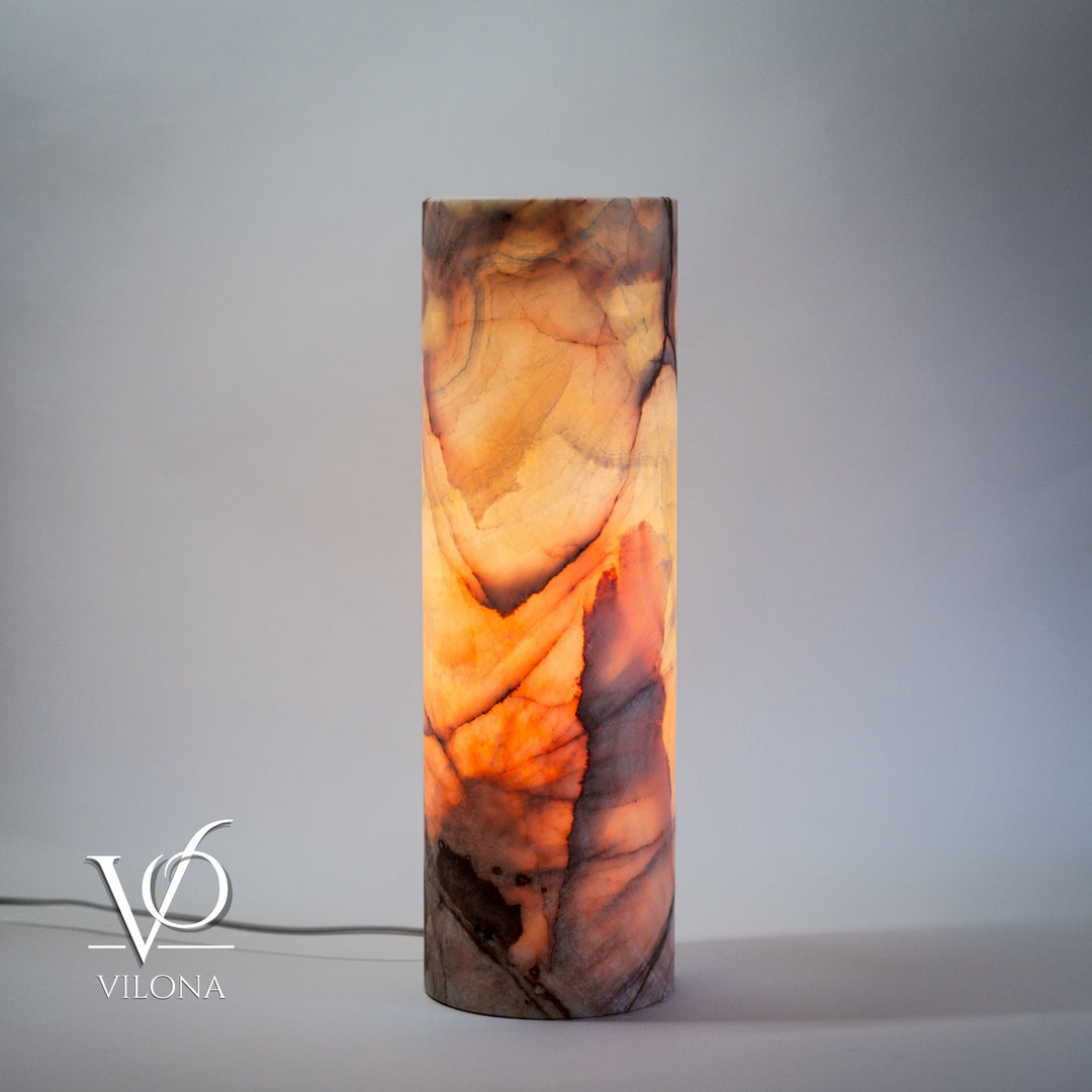 Cylindrical onyx-pattern table lamp, warm orange stone with dark streaks