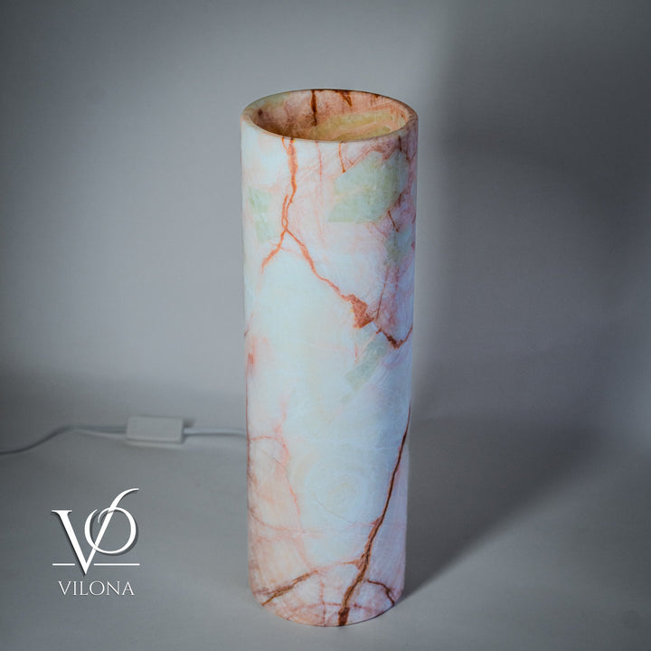 Cylindrical light-blue onyx-pattern table lamp with red-orange veining; open top