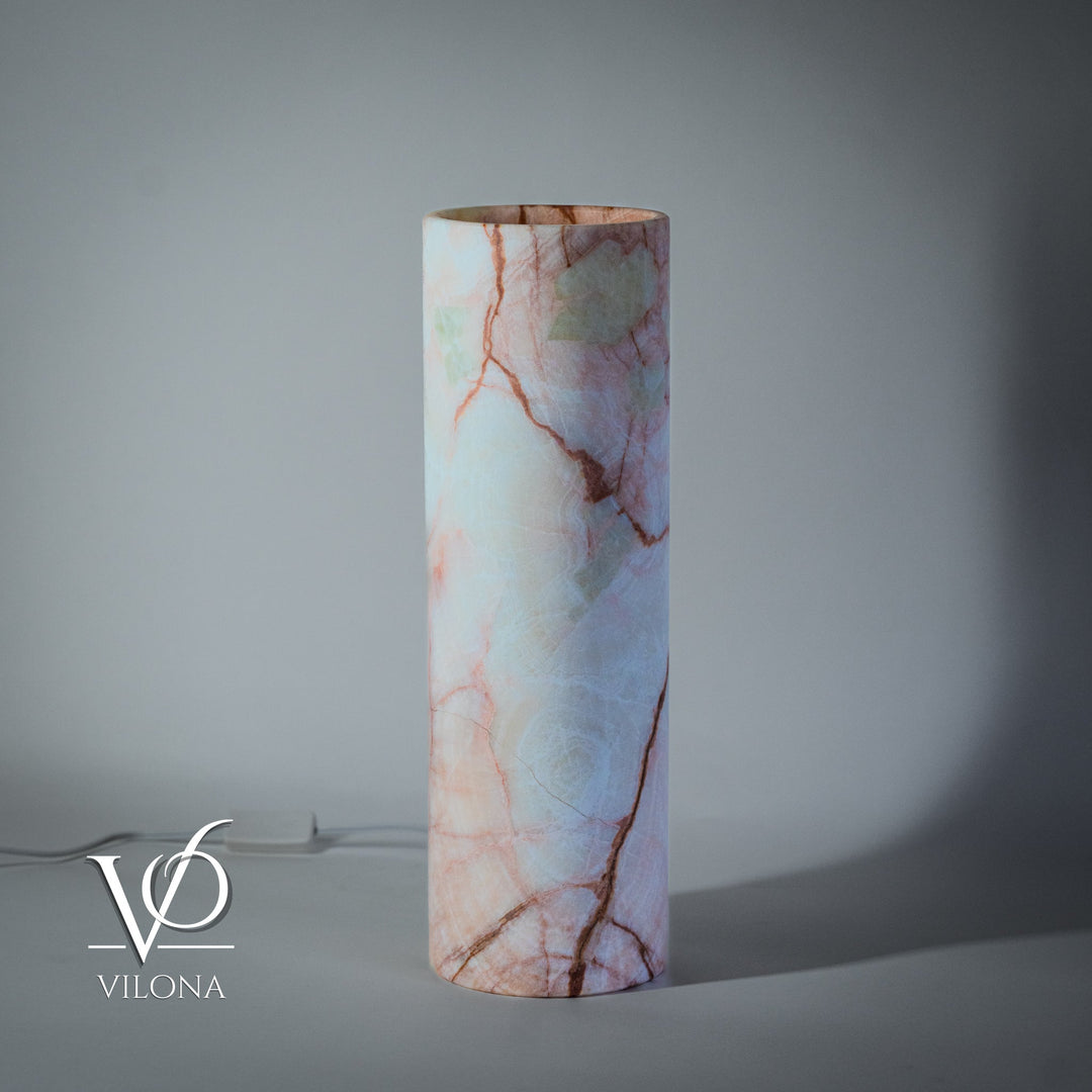 Cylindrical light-blue onyx-pattern table lamp with red-orange cracks and cord