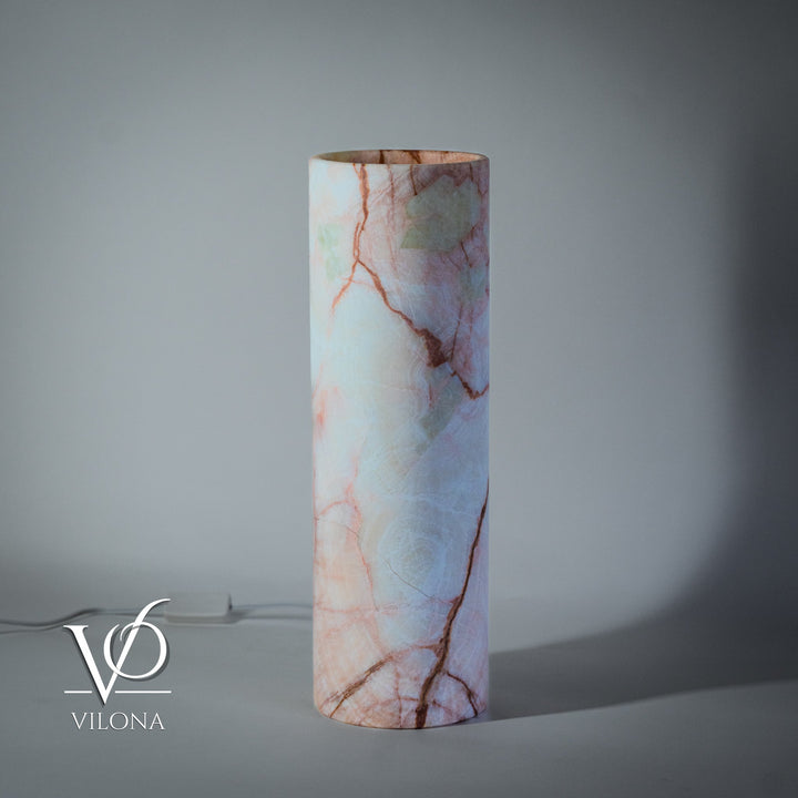 Cylindrical light-blue onyx-pattern table lamp with red-orange cracks and cord