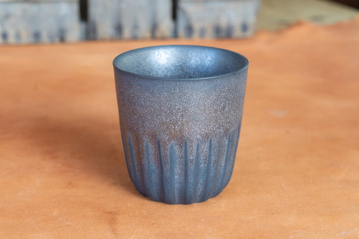 Metallic speckled mug with fluted ridges and wide round rim