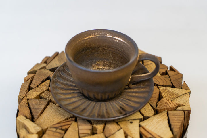 Espresso cup and saucer set with textured glaze, on ribbed saucer