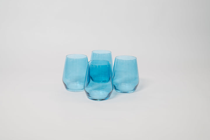 Three blue tinted stemmed wine glasses with rounded bowls and slender stems.