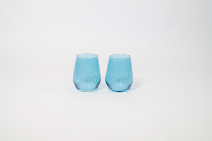 Two blue tinted stemmed wine glasses with flared rims and clear stems.