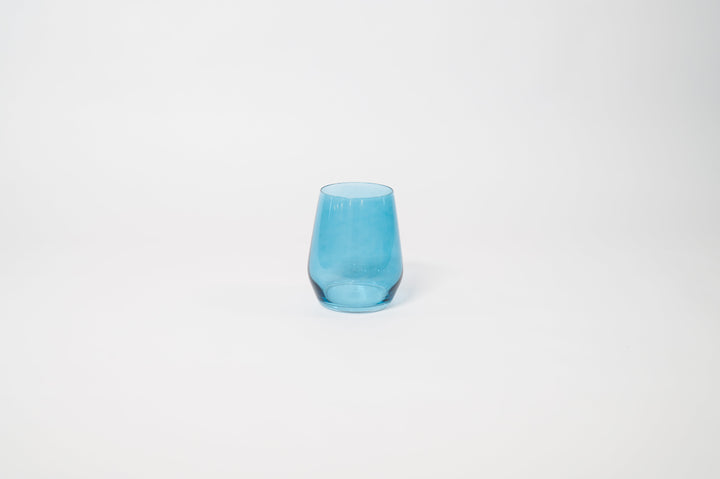 Blue tinted stemmed wine glass with a rounded bowl and slender clear stem.