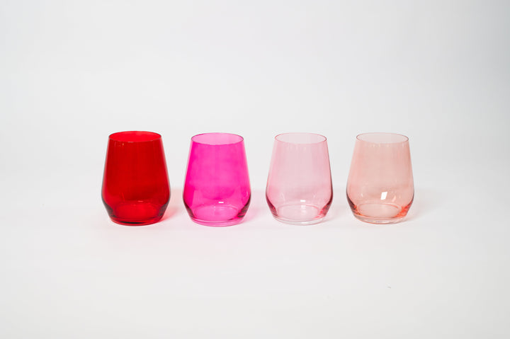 Set of four stemless ombre wine glasses in red, fuchsia, blush, and light pink
