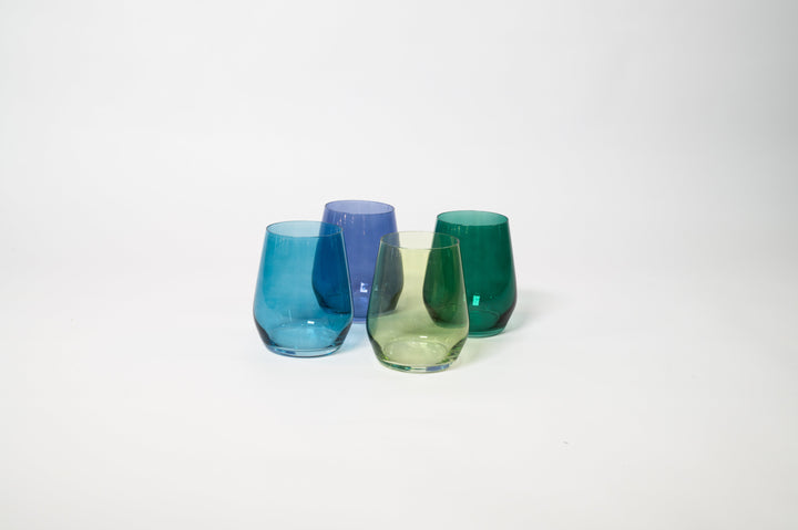 Set of 4 stemmed colored wine glasses in blue and green hues, angled grouping.