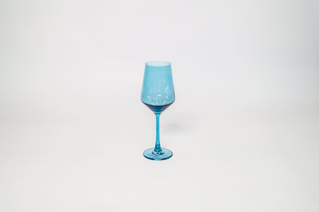 Single blue tinted stemmed wine glass with rounded bowl and stem base.