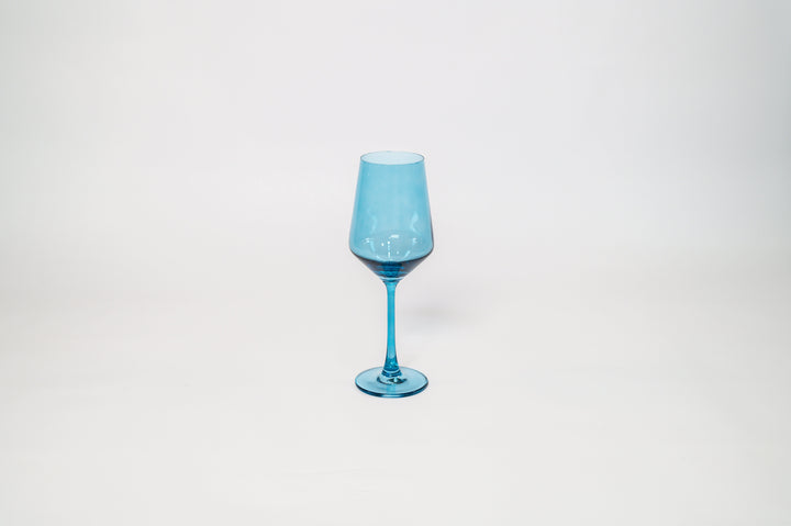 Single blue tinted stemmed wine glass with rounded bowl and stem base.