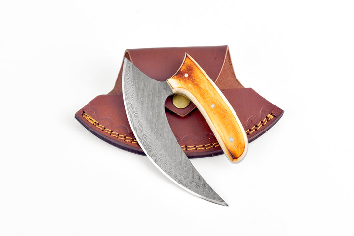 Damascus-style knife with amber handle and open brown leather sheath