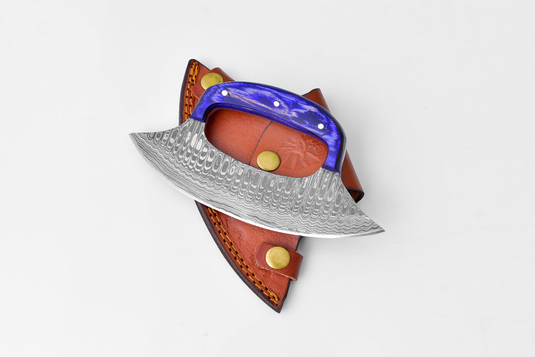 Damascus steel ulu knife with blue handle, leather sheath, and curved blade