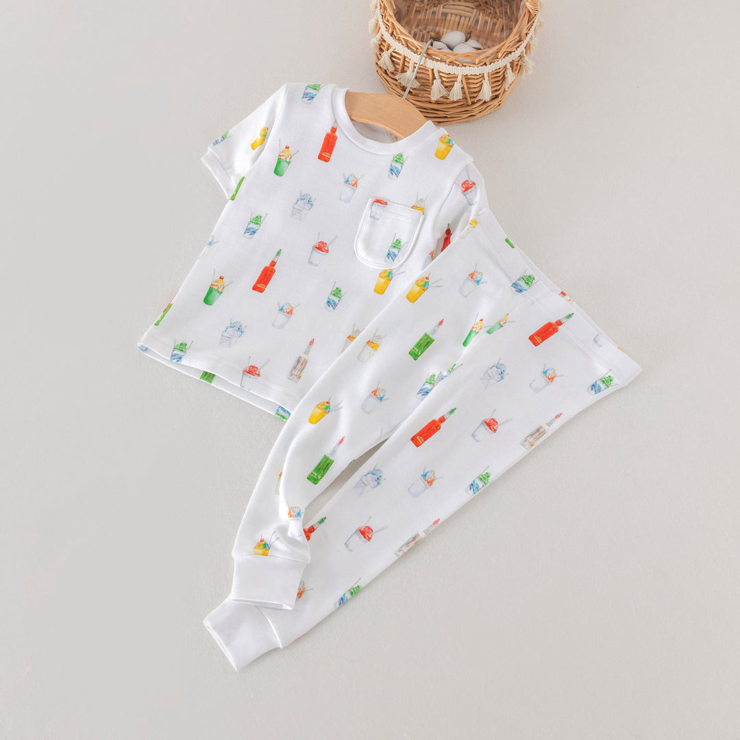 Kids pajama set with white long-sleeve top and matching jogger pants, popsicle pattern