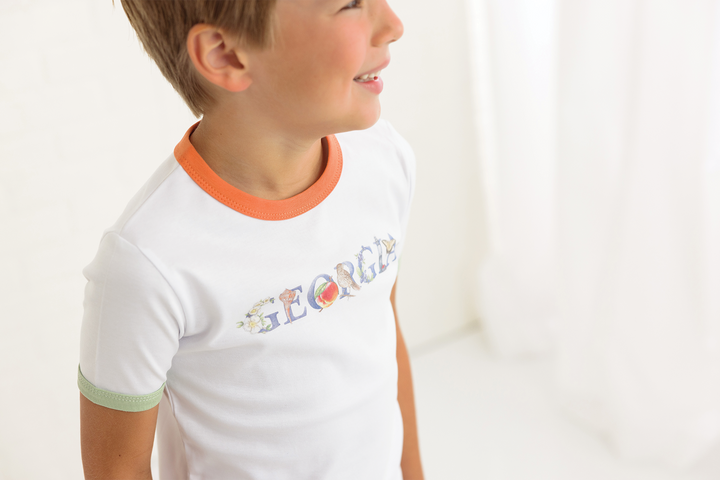 Kids white tee with orange crew neck and green sleeve cuffs, Georgia graphic